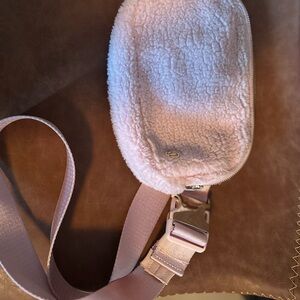 Pink sherpa Lululemon belt bag